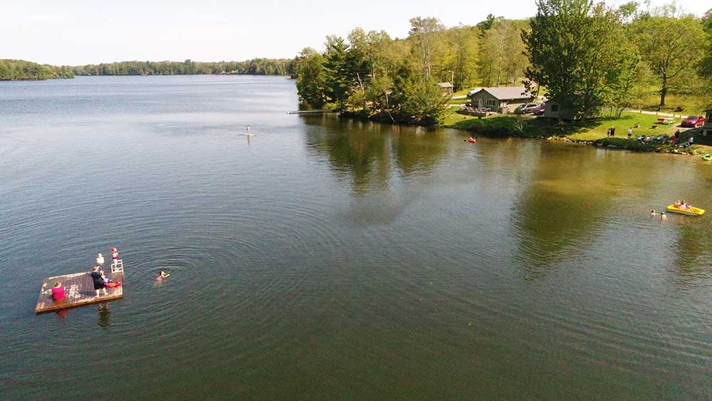 kids swimming in a lake