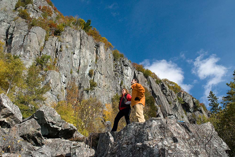 hiking looking up a cliff face