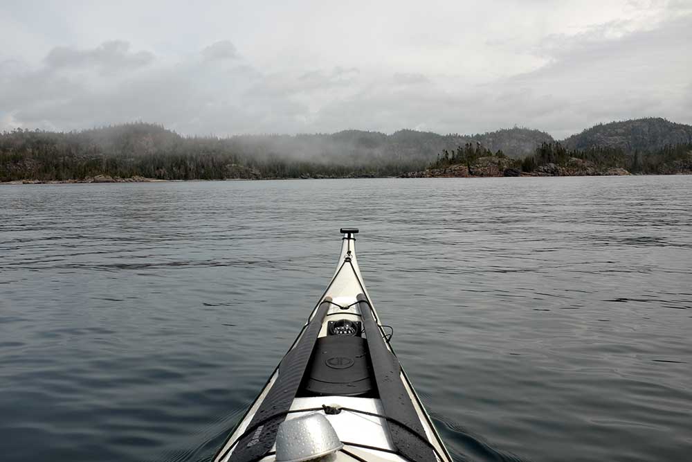 kayak on misty lake
