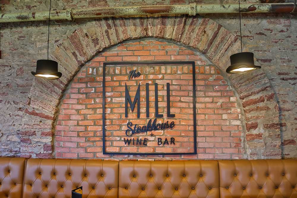mill steakhouse brick wall