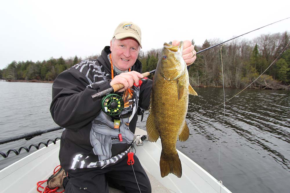 the new fly fisher catching smallmouth bass