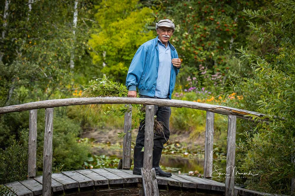 man standing on a bridge