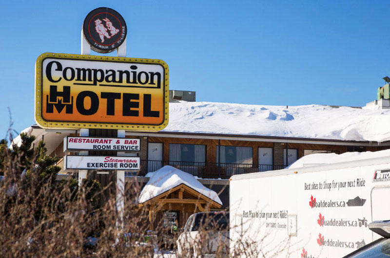 companion hotel motel sign
