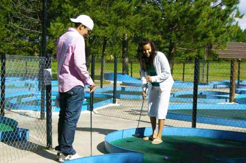 people playing mini golf