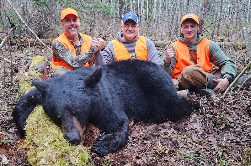 hunters with ontario black bear
