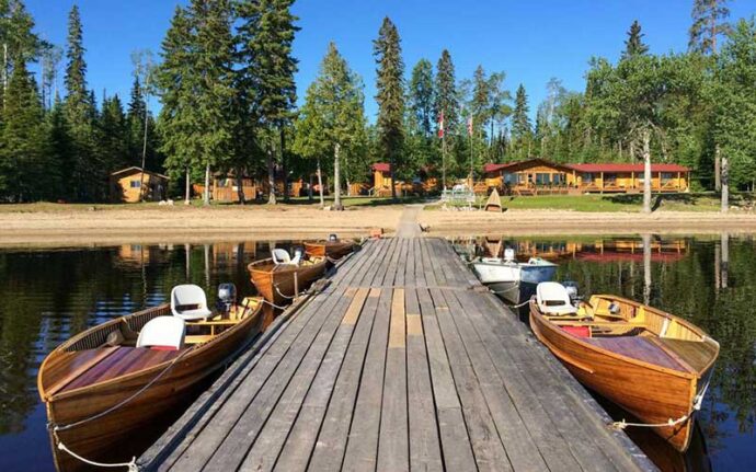 cedar strip boats docked at lodge